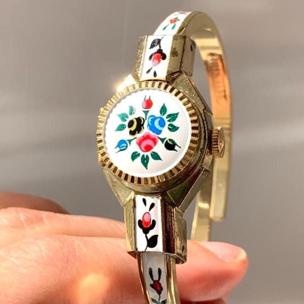 Swiss Peek a boo watch with floral design